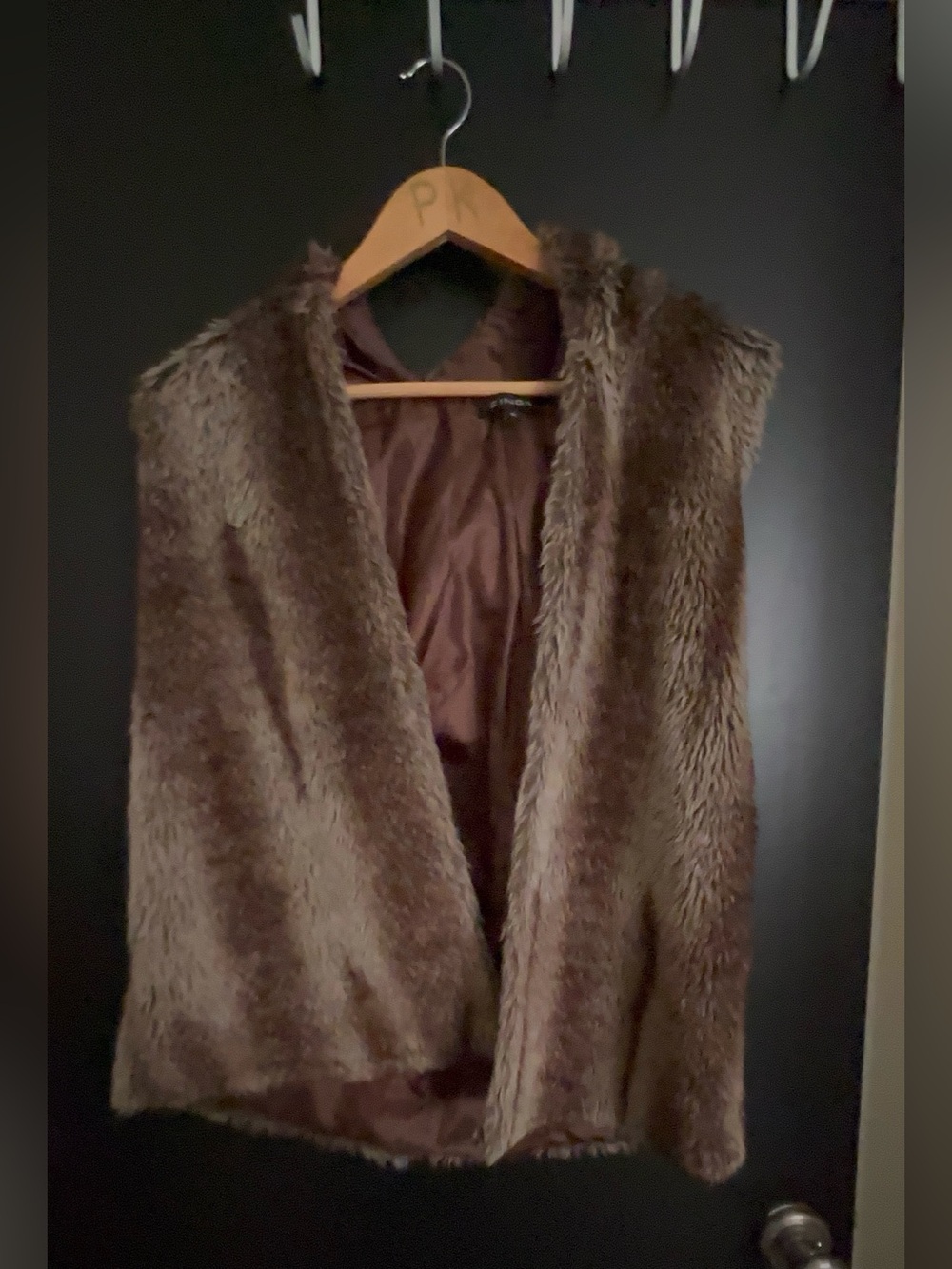 ZINGA faux fur jacket with a brown lining.